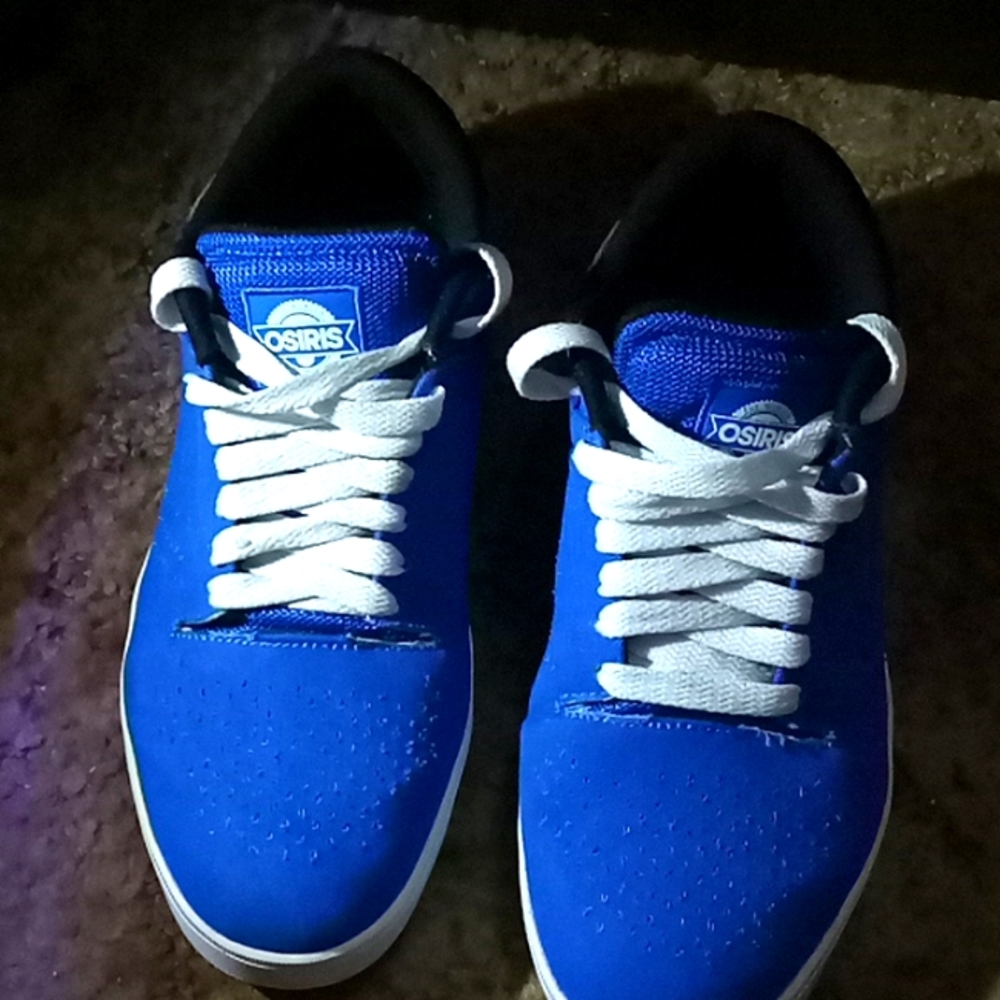 Pair of blue and white Osiris size 9.5 shoes.
